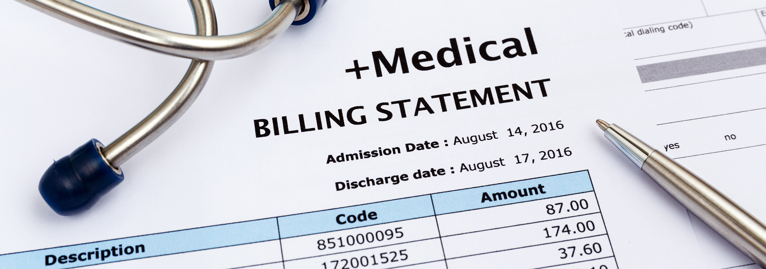 Close-up of medical billing statement with codes and amounts, stethoscope, and pen, representing healthcare costs and insurance claims.
