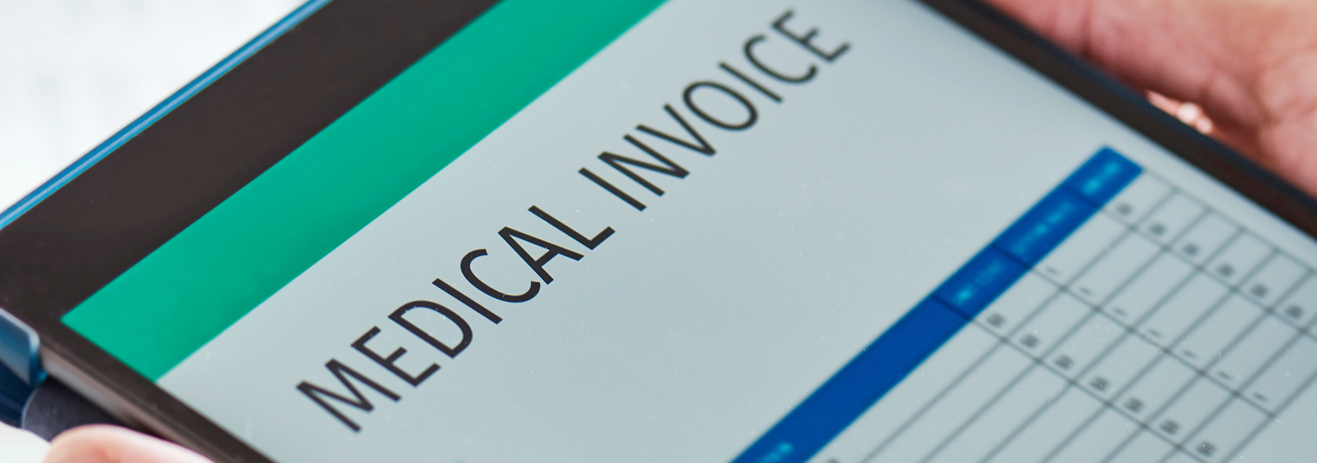 Digital tablet displaying a medical invoice, representing healthcare billing, claims review, and payment processing.