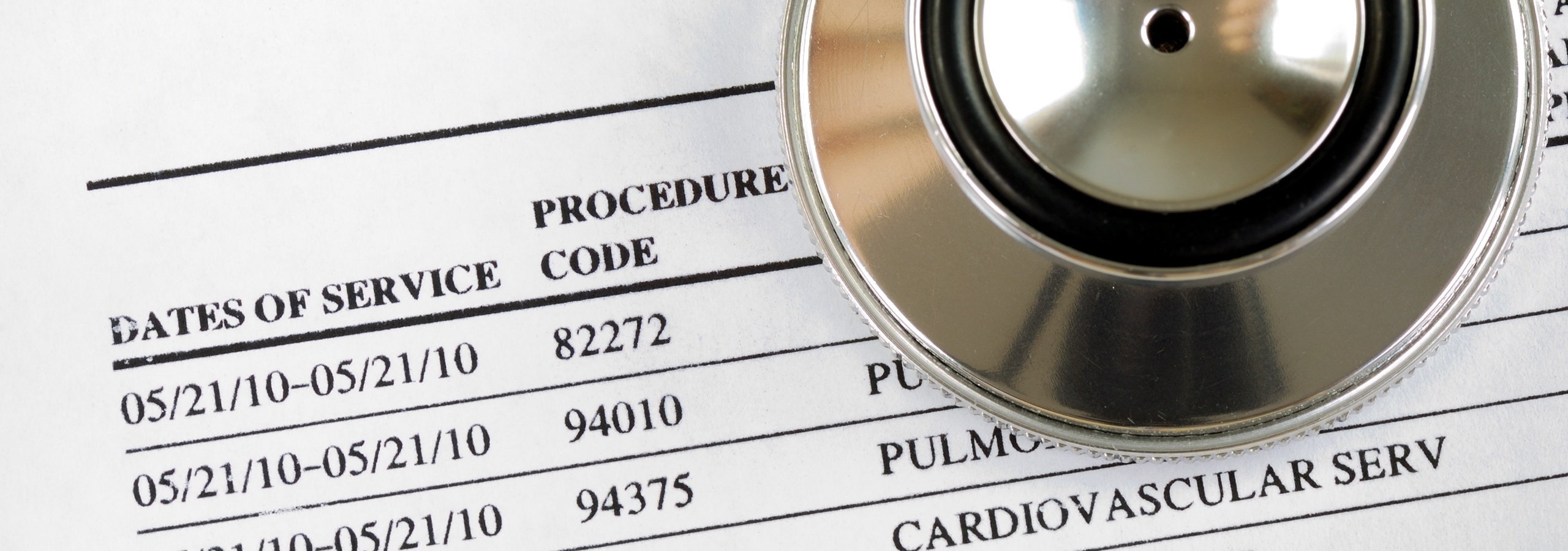 Close-up of medical bill with procedure codes and stethoscope, representing healthcare costs, coding accuracy, and medical review.